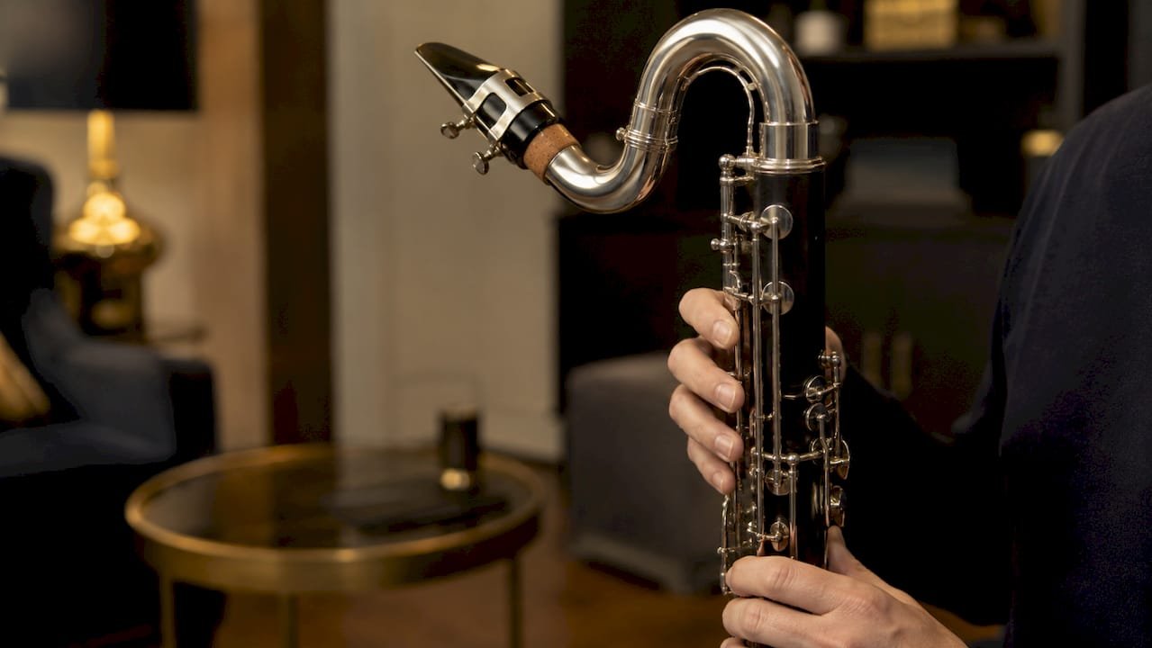 Bass Clarinet Altissimo Register Explained for Players Hands holding bass clarinet focusing embouchure area