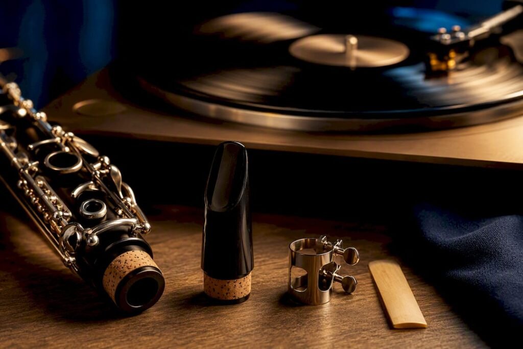 Clarinet components beside recording playback equipment